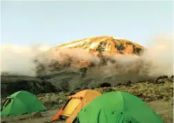  ??  ?? A view of Mt. Kilimanjar­o with our tents from Karanga Camp, at 3,995 meters above mean sea level (AMSL).