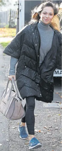  ??  ?? Katya Jones smiles, while dance partner Seann Walsh hides behind shades as they arrived for rehearsals this week