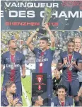  ?? AP ?? PSG’s Thiago Silva holds the trophy.