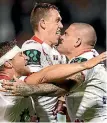  ??  ?? Russell Packer, right, celebrates with team-mates after scoring a try for the Dragons. He is joining the Wests Tigers in 2018.