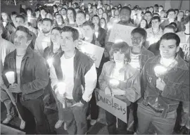  ?? Photograph­s by Eike Schroter ABC ?? CANDLELIGH­T VIGILS are part of the history told in “When We Rise.”