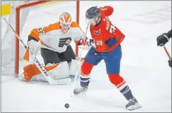  ?? Nick Wass The Associated Press ?? Capitals right wing Anthony Mantha handles the puck in front of Flyers goaltender Brian Elliott during the first period of Tuesday’s game.