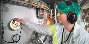  ??  ?? A technician checks production at the Synutra baby milk factory in Carhaix-Plouguer, France.