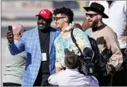  ?? ROSS D. FRANKLIN - AP ?? Former Chief player Christian Okoye, left, takles a photo with Kansas City Chiefs quarterbac­k Patrick Mahomes and tight end Travis Kelce as they arrive ahead of Super Bowl 57, Sunday, Feb. 5, 2023, in Phoenix.