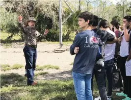  ?? PHOTOS BY STEVE WATERS Special to the Miami Herald ?? Ron Bergeron talks to high school juniors who attended Youth Leadership Broward’s Environmen­tal Day that featured a tour of Bergeron’s Green Glades West ranch.