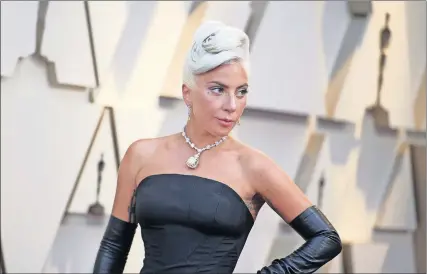  ?? SHOTWELL/INVISION/AP] [RICHARD ?? Lady Gaga, wearing Tiffany's most precious diamond, arrives Sunday at the Oscars at the Dolby Theatre in Los Angeles.