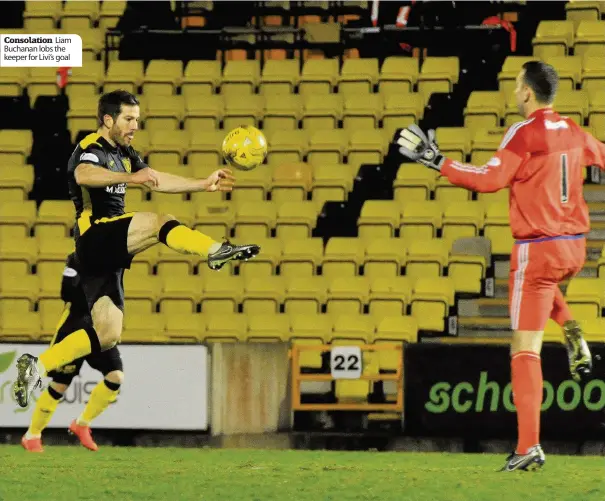  ??  ?? Consolatio­n Liam Buchanan lobs the keeper for Livi’s goal