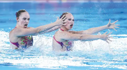  ?? EZRA SHAW/GETTY IMAGES ?? Claudia Holzner and Jacqueline Simoneau of Canada took home the gold in artistic swimming duet at the 2019 Pan American Games in Lima on Wednesday.