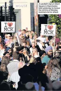  ??  ?? A candlelit vigil at Albert Square in Manchester, held yesterday to honour the victims of Monday evening’s terror attack