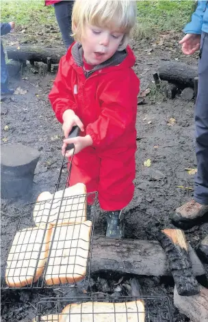  ??  ?? Children playing at the Ladybird outdoors toddler group in Dare Valley Country Park