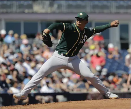  ?? ELAINE THOMPSON — THE ASSOCIATED PRESS ?? Oakland’s Jesus Luzardo struck out eight batters in 31⁄3 innings in Saturday’s 8-4Cactus League victory vs. the Seattle Mariners.