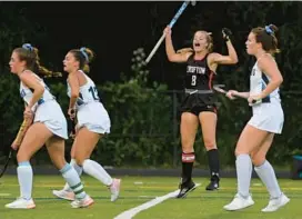  ?? BRIAN KRISTA/CAPITAL GAZETTE ?? Crofton’s Kylie Corcoran celebrates after scoring a goal during a 4-0 win over South River on Thursday night. Corcoran finished with two goals to lead the Cardinals.