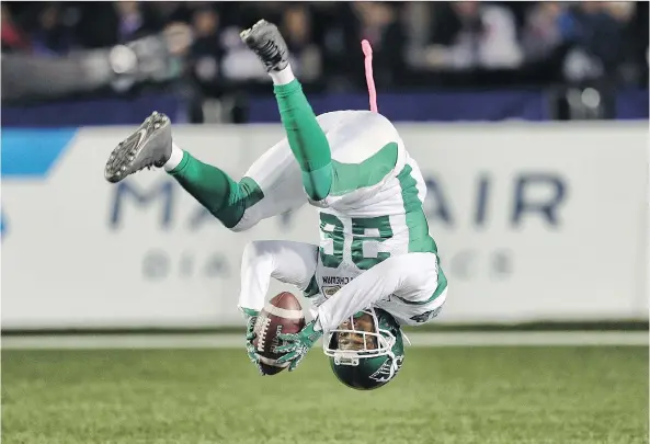  ?? AL CHAREST ?? Saskatchew­an Roughrider­s returner Christion Jones flips into the end zone to complete a punt-return touchdown Friday in a win over the host Calgary Stampeders.