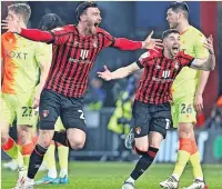  ?? ?? BOURNE AGAIN Moore and Ryan Christie celebrate promotion