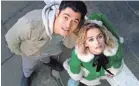  ?? UNIVERSAL PICTURES ?? Tom (Henry Golding) gets Kate (Emilia Clarke) out of a deep funk in “Last Christmas.”