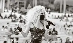  ?? Robin Jerstad / Contributo­r ?? A performers wears a mask during a show at the Sundance Theater during Halloween activities at Six Flags Fiesta Texas. Officials say they are following virus guidelines; city inspectors will check on the park.