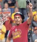  ?? AMY KONTRAS/USA TODAY SPORTS ?? Iowa State sophomore Tamin Lipsey holds up a piece of cut net after the Cyclones beat Houston in the Big 12 Tournament final on Saturday in Kansas City.