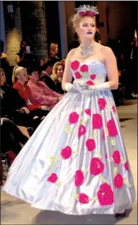  ??  ?? True to the name of its designer, a Rosie Rose ballgown displays a cascading-rose motif.