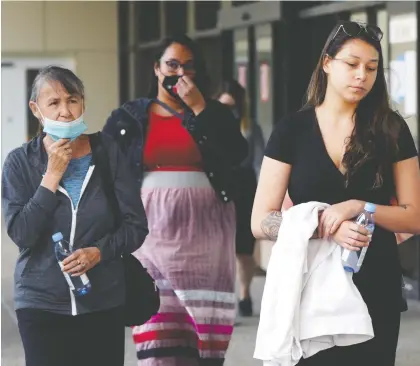  ?? LARRY WONG ?? Cindy Gladue's mother, Donna Mcleod, left, and Gladue's daughter, Cheyanne Gladue, right, leave the Edmonton courthouse Tuesday after Bradley Barton was sentenced to 121/2 years for killing Cindy Gladue in a hotel room at the Yellowhead Inn in 2011.