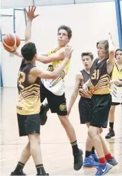  ??  ?? Bunyip Storm player Hayden McCarthy gets a lay up against Gladiators in the U16A competitio­n.