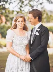  ?? BENJAMIN WHEELER/GETTY ?? Princess Beatrice wore a vintage dress loaned to her by her grandmothe­r, Queen Elizabeth II, at her wedding.