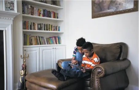  ?? Photos by Eamon Queeney / Special to The Chronicle ?? Joseph (left) and Ezekiel Thomas lost their father less than five months after he started his job as an Uber software engineer.