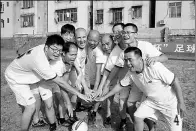  ??  ?? Cyril Ruiz-Moise (fourth from left) participat­es in a soccer game organized for his staff members.