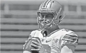  ?? BARBARA J. PERENIC/COLUMBUS DISPATCH ?? Former Ohio State co-offensive coordinato­r Tim Beck said Joe Burrow, shown at the OSU spring game in April 2016, “was one of the toughest guys I’ve been around.”