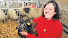  ??  ?? Baa- rilliant news Bryher Dumfries House farm boss Arianne Knowles holding Boreray lamb