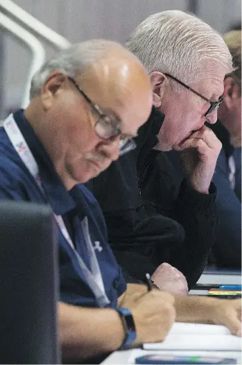  ?? DAVID BLOOM ?? Scouts prepare for the Canada and Switzerlan­d game Monday at Rogers Place during the Hlinka Gretzky Cup, the first big tournament of the year for draft-eligible players.