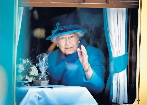  ?? ?? Elizabeth II on September 9 2015, the day she became Britain’s longest reigning monarch, at a carriage window at Waverley Station, Edinburgh
