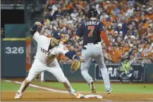  ?? AP file photo ?? The Nationals’ Trea Turner knocks the glove away from the Astros’ Yuli Gurriel during the seventh inning of Game 6 of the World Series on Oct. 29, 2019.