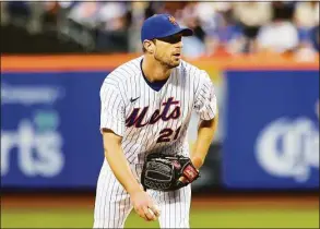  ?? Jessie Alcheh / Associated Press ?? New York Mets starting pitcher Max Scherzer looks towards the catcher against the Philadelph­ia Phillies during the second inning on May 1.