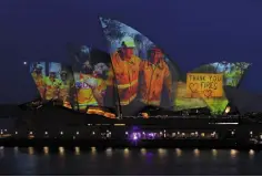  ??  ?? Dominic Nicholls
FIRE TRIBUTE: Projection­s on the sails of the Sydney Opera House yesterday in recognitio­n of those affected by fires across Australia. Photo: AAP Image/Paul Braven/via REUTERS