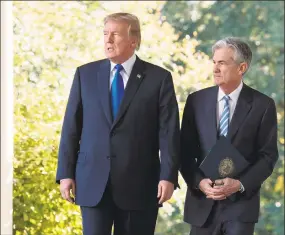  ?? Nicholas Kamm / AFP/Getty Images ?? President Donald Trump walks with Jerome Powell, Federal Reserve chairman, at the White House on Aug. 7.