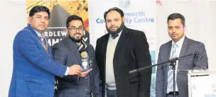  ??  ?? ●●Deputy mayor Coun Asim Rashid (left) presenting an award to Akra Amin, with Shaukat Ali and Mohammed Doulot Miah