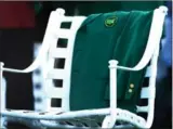  ?? JEFF SINER, CHARLOTTE OBSERVER ?? One of Palmer’s green jackets is displayed at the first tee box at the opening shot ceremony.