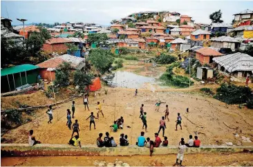  ?? [AP PHOTO] ?? Rohingya refugees play Monday at Balukhali Refugee Camp in Bangladesh. Investigat­ors working for the U.N.’s top human rights body said Monday that Myanmar military leaders should be prosecuted for genocide against Rohingya Muslims.