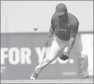  ?? AP/BRYNN ANDERSON ?? St. Louis Cardinals shortstop Ruben Tejada mishandles a grounder during Saturday’s exhibition game against the Washington Nationals in Jupiter, Fla. It was one of the Cardinals’ five errors in the 7-0 loss.