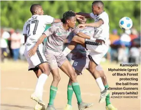  ?? PIC: KENNEDY RAMOKONE ?? Kamogelo Mphahlele (grey) of Black Forest protecting the ball from Extension Gunners players (white)