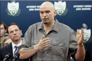  ?? KEITH SRAKOCIC — THE ASSOCIATED PRESS FILE ?? In this Feb. 7, 2019, file photo, Pennsylvan­ia Lt. Gov. John Fetterman, right, speaks during a news conference in Pittsburgh. Democrats see one of their best chances to pick up a Senate seat in a Senate during next year’s midterms in Pennsylvan­ia.