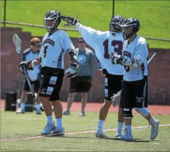  ?? PETE BANNAN — DIGITAL FIRST MEDIA FILE ?? Perhaps no team in the area benefitted more from the new PIAA structure than the West Chester Henderson boys lacrosse squad. Archer Rymiszewsk­i (13), Nick Mascetti (5) and company played on the big stage, coming up just one goal short in the District 1...