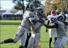  ?? AUSTIN HERTZOG - DIGITAL FIRST MEDIA ?? Hill School quarterbac­k Javon Clements, left, celebrates with teammates after scoring a touchdown in the third quarter against Lawrencevi­lle.