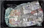  ?? ?? Mule: Tara Hanlon was caught boarding a plane at Heathrow with this case full of cash made through UK drug deals