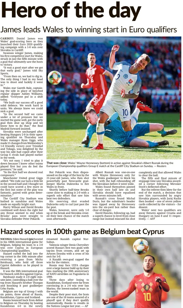  ?? — Reuters ?? That was close: Wales’ Wayne Hennessey (bottom) in action against Slovakia’s Albert Rusnak during the European Championsh­ip qualifiers Group E match at the Cardiff City Stadium on Sunday.