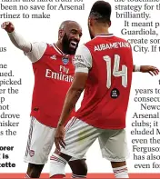  ??  ?? JOY BOYS: Scorer Aubameyang is hailed by Lacazette