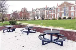  ?? Arnold Gold / Hearst Connecticu­t Media file photo ?? Outdoor seating in front of Bartels Hall Campus Center remain empty at a deserted University of New Haven campus in West Haven in April.