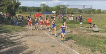  ?? COURTESY OF NMAA ?? Peñasco runners jump out to the lead at the Peñasco cross country invite earlier this season.