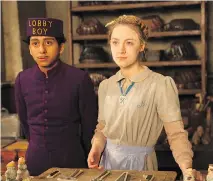  ??  FOX SEARCHLIGH­T ?? Tony Revolori, left, and Saoirse Ronan in The Grand Budapest Hotel. Its nomination­s include best original screenplay.