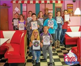  ?? SUBMITTED PHOTO - JOEL SEIDEL ?? Peace. Love. Kutztown hosted a Coloring Contest. Pictured are the ages 12 and up winners. Back row left to right: Mathias Warmkessel, Carlee Hilbert, Sarah Fly, Marnia Schnell, KU Rep. Siglinda Harrison, Reanna Reynolds and Rocky Walter. Middle Row:...